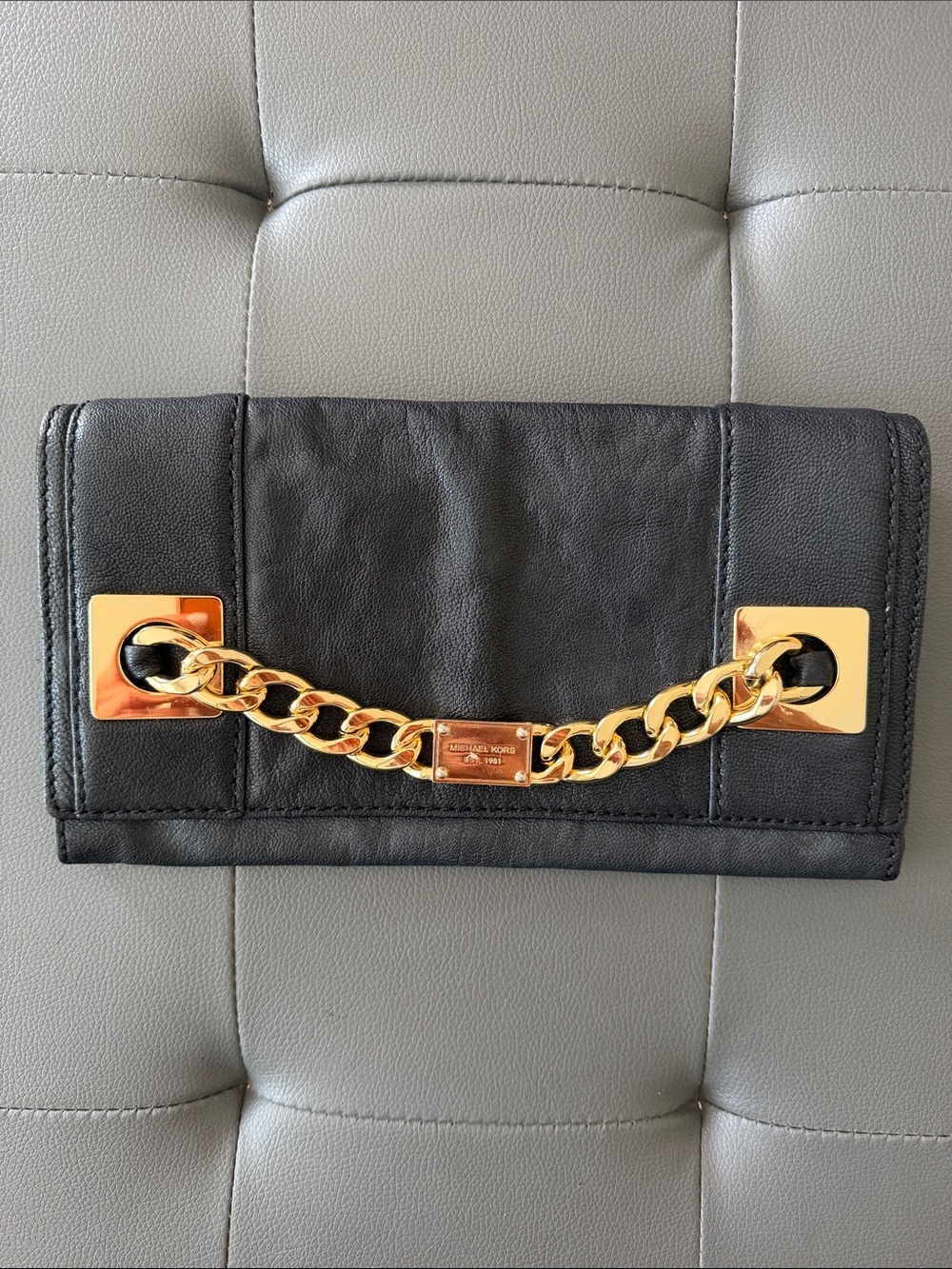MICHAEL Michael Kors Black Leather Clutch with Gold Chain Trim